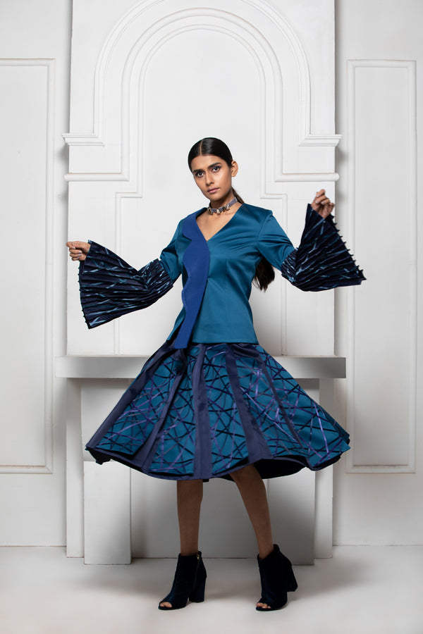 BLUE MONOTONE KNIFE PLEAT SKIRT WITH SATIN RIBBON TEXTILE PANEL DETAILS - siddhantagrawal