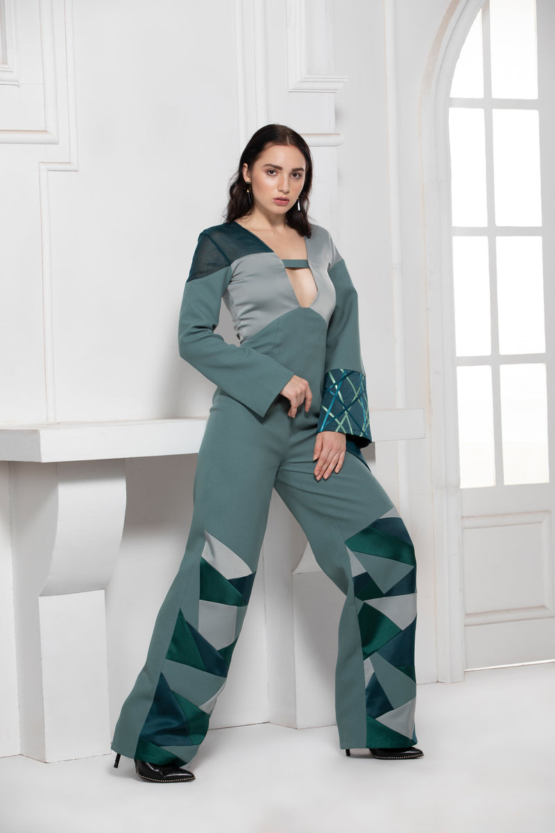 GREEN MONOTONE SATIN CREPE JUMPSUIT WITH ONE SIDE FLARED SATIN TEXTILE SLEEVE - siddhantagrawal